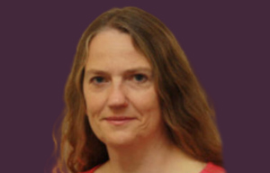 Centre Director head shot with purple background.
