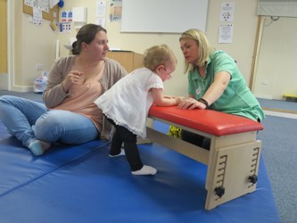 Child Standing With Therapist