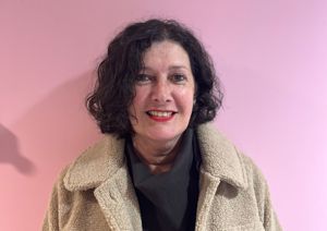 Our Trustee in front of our pink wall.