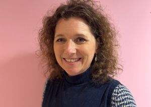 Our Trustee in front of our pink wall.