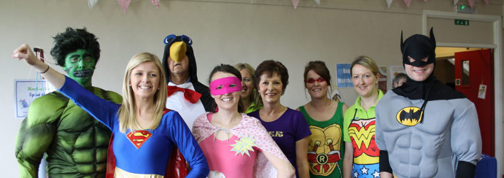 staff members dressed as superheroes