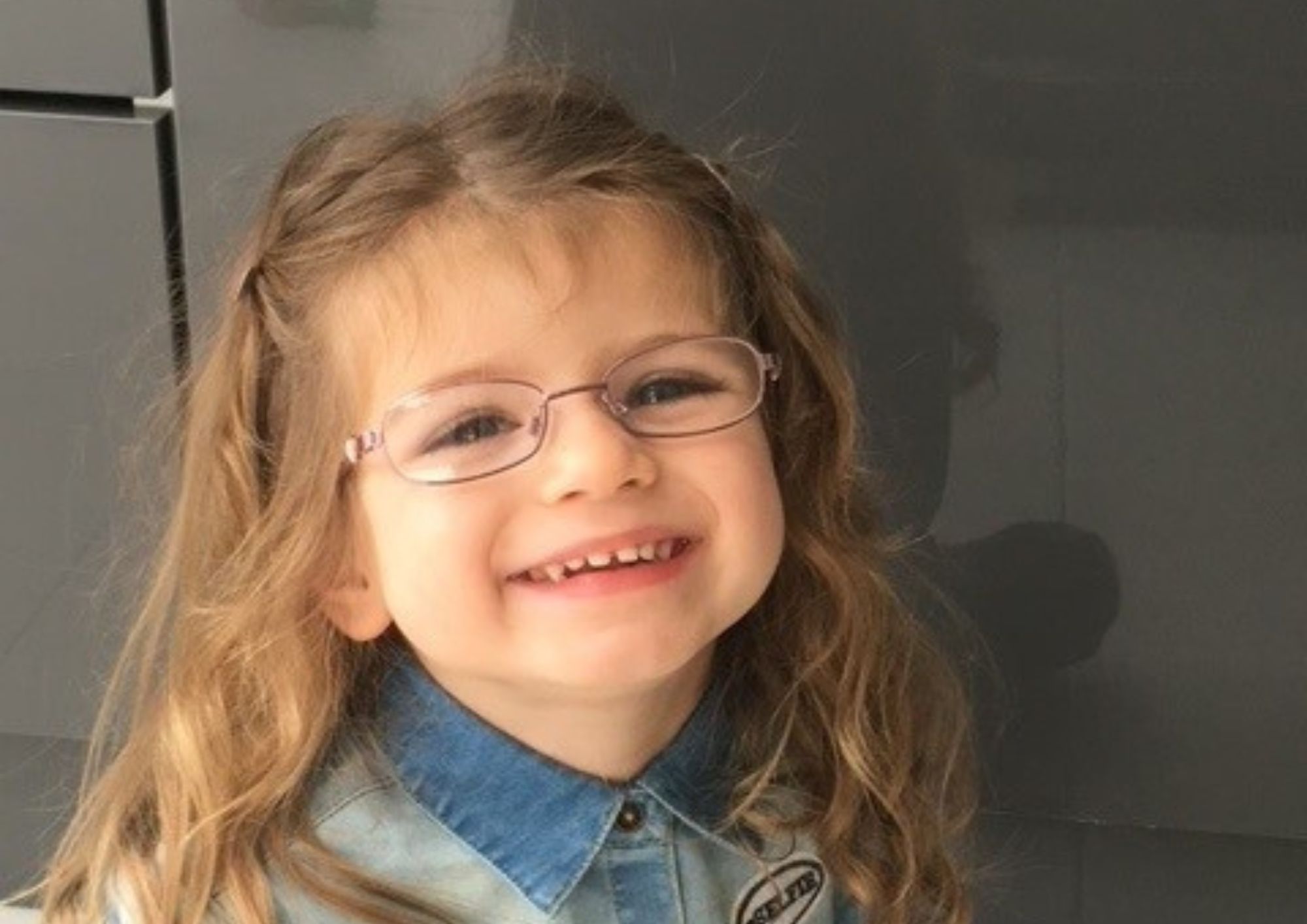 Amelia smiling up at camera