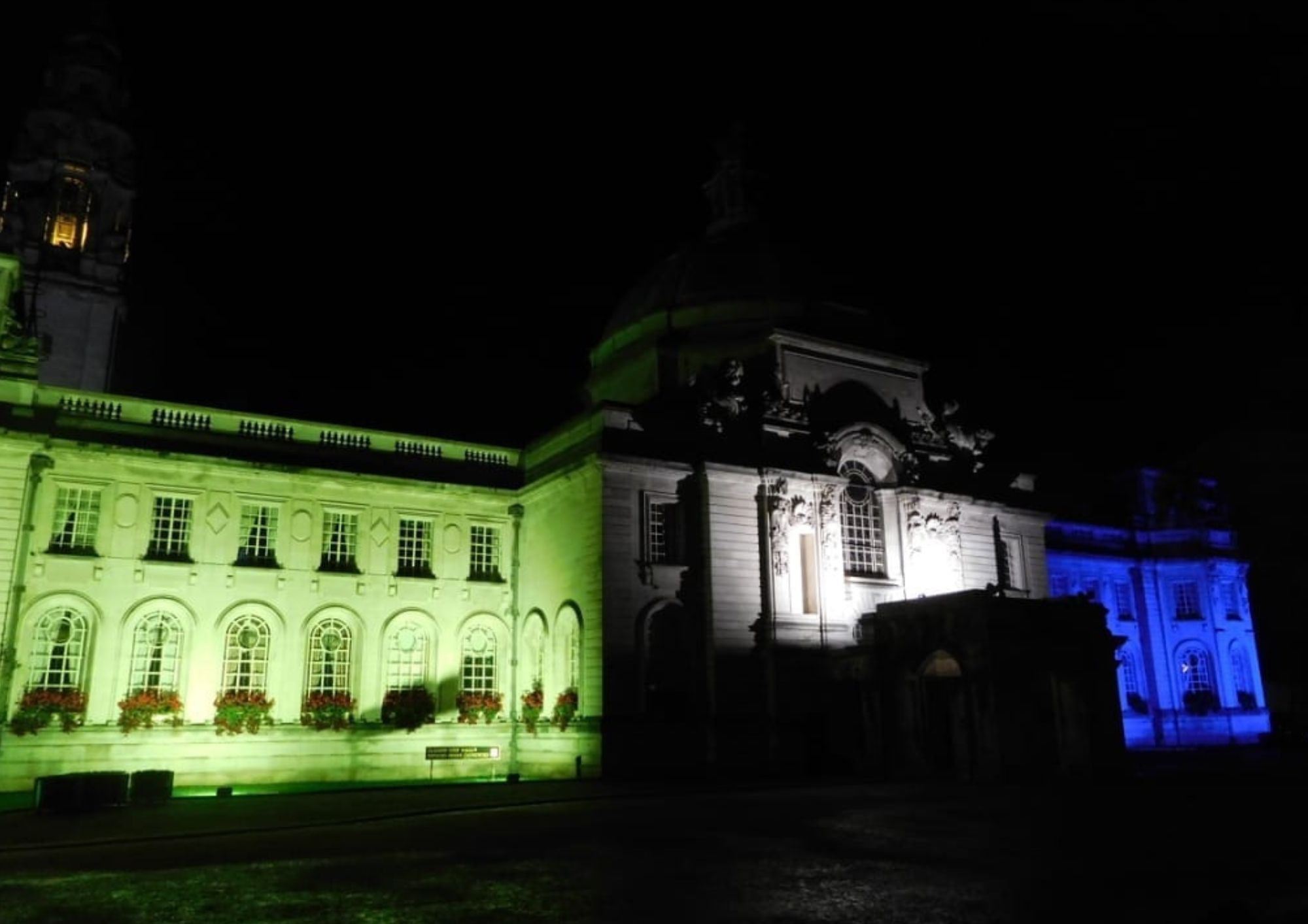 Cardiff City Hall lit up green and blue