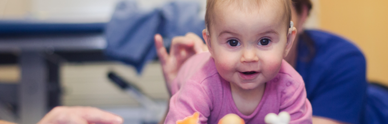 baby girl crawling towards camera