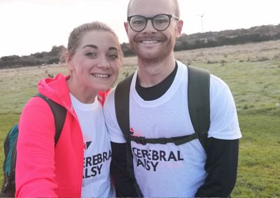 Man and woman in Cerebral Palsy tshirts