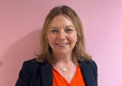 Our Trustee in front of our pink wall.