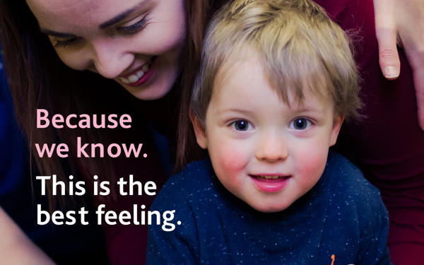 Child looking into the camera with mother. Text on the left reads Because we know (in pink), This is the best feeling (in white).