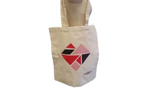 Photograph of Cerebral Palsy Cymru branded tote bag. Canvas with our tangram heart.