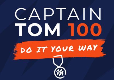 Navy background with white and red text reading CAPTAIN TOM 100, DO IT YOUR WAY. Underneath is a graphic of a white medal.