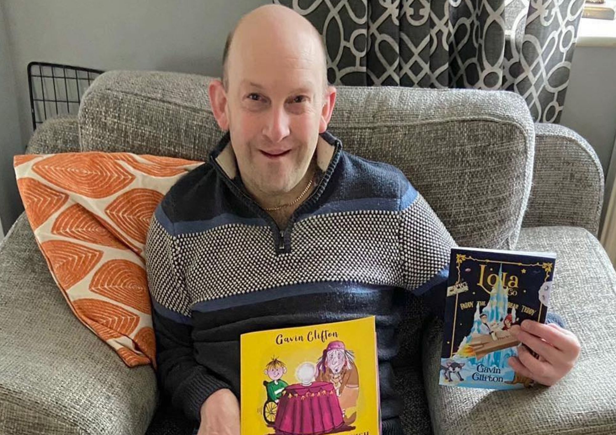 Author holding his book