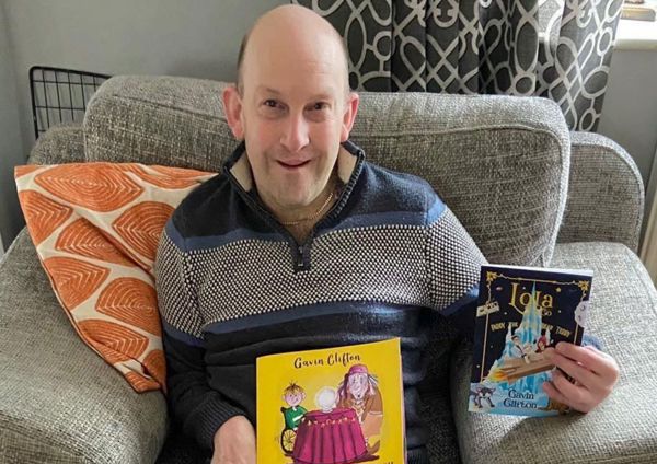 Author holding his book