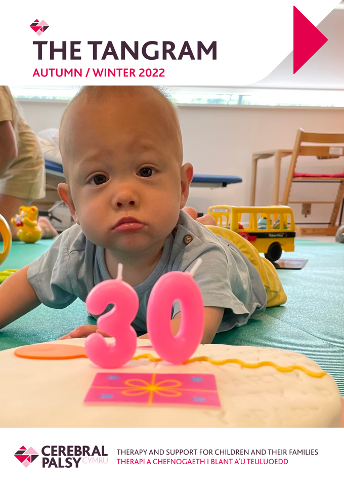 Screenshot of Tangram Newsletter, Autumn/ Winter 2022. Photograph shows young boy lying on his front, looking at the camera. In front of him is a birthday cake with the numbers 30 on it.