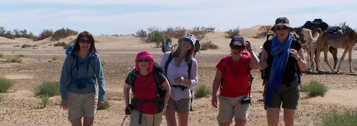 Group of people looking at camera on Sahara Trek