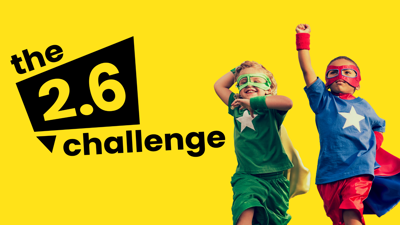 Photograph of 2 young boys dressed as superheroes with yellow background and black text reading the 2.6 challenge.
