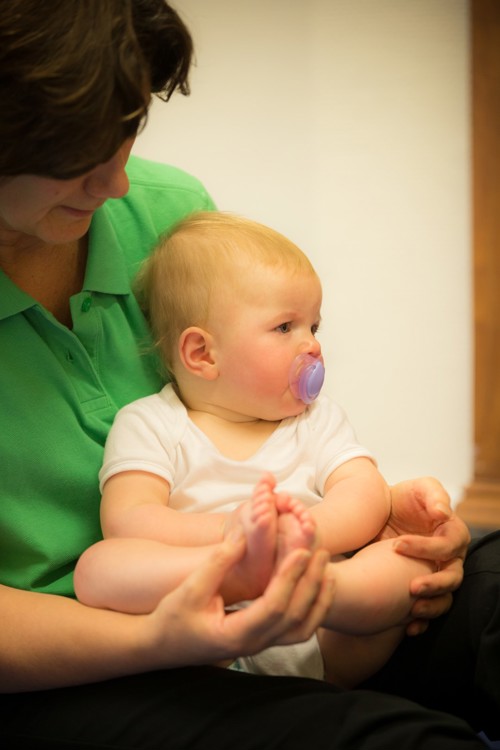 baby being held by a therapist