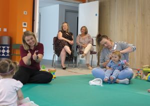 Photographs of families and therapists alongside two Slater & Gordon lawyers during our Better Start Playgroup.