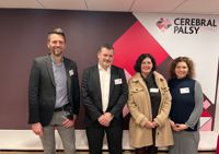 Photograph of our new trustees standing in front of our branded wall in our centre. From left to right, Toby Jones, Jason Llewellyn,Vicky Stevenson, Lisa Tregale.