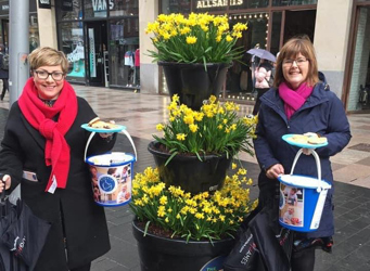 2 ladies bucket collecting